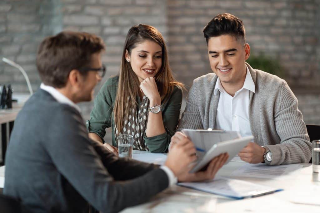 young-happy-couple-having-consultations-with-bank-manager-meeting-office-1024x683